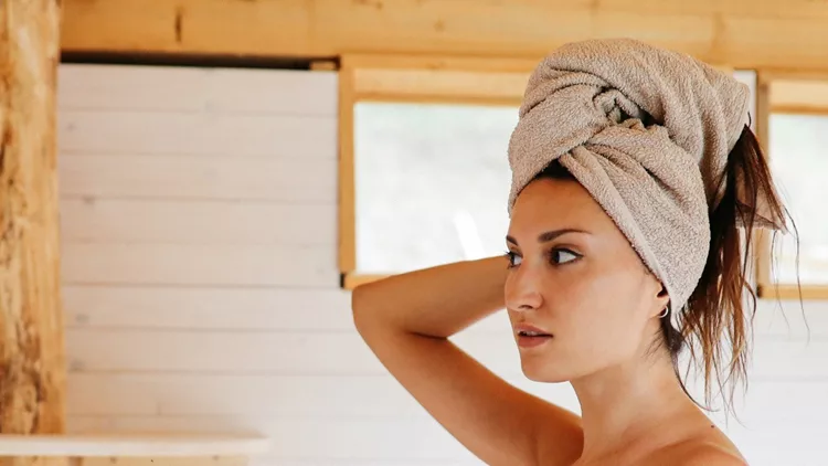 brunette-woman-after-shower-in-the-house-bathroom-picture-id1177306815