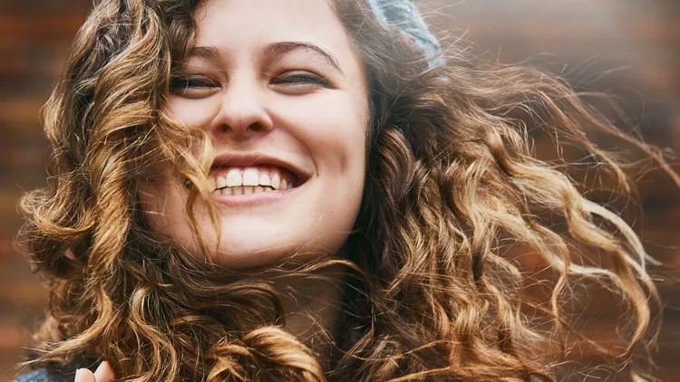 beautiful-girl-with-winter-windblown-hair-laughs-picture-id892663048