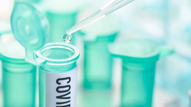 corona-virus-vial-with-pipette-in-laboratory-picture-id1206578214
