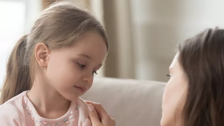 loving-mom-talking-to-upset-little-child-girl-giving-support-picture-id1134909206