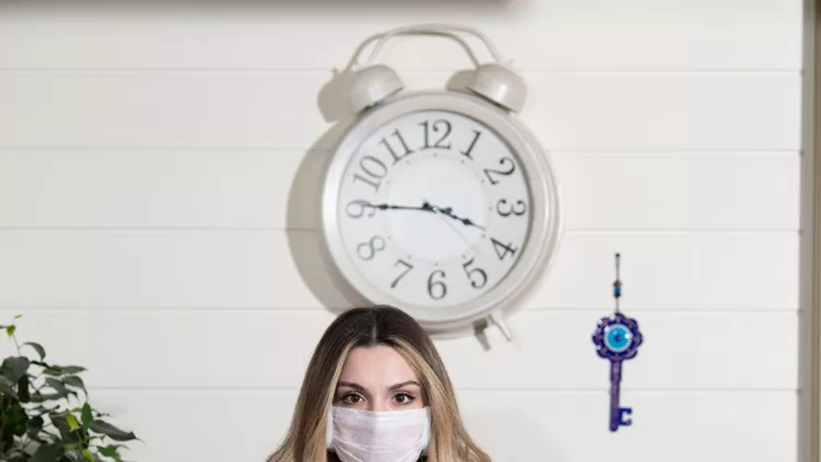 receptionist-woman-is-protected-from-coronavirus-picture-id1208190067