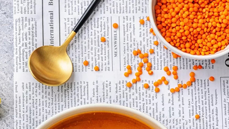 top-view-of-two-plates-with-creamy-and-spice-with-lentil-soup-picture-id1178303583 (1)