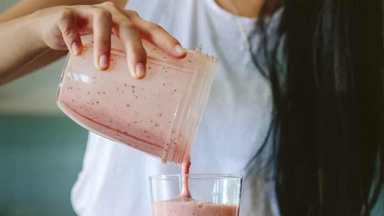 woman-preparing-fresh-fruit-smoothie-picture-id1070646542 (1)