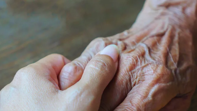 help-concept-hands-of-the-elderly-and-young-picture-id1155911215