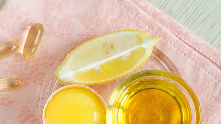 olive-oil-raw-egg-lemon-and-vitamin-e-softgels-ingredients-for-diy-picture-id1135535372