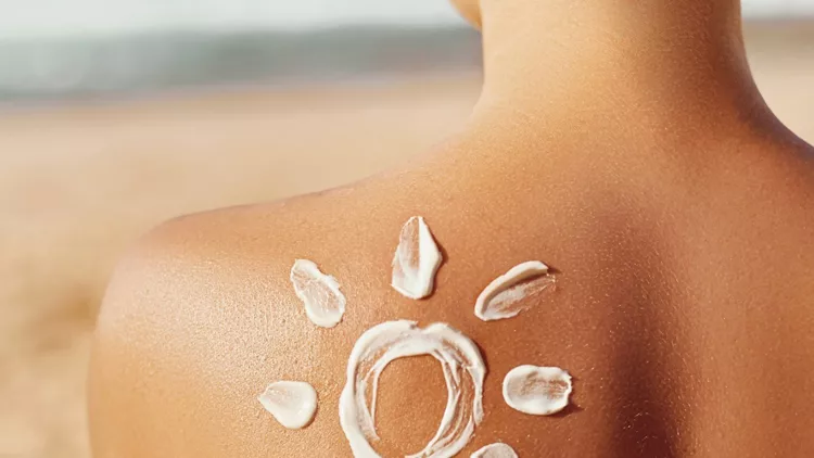 skin-care-sun-protection-woman-apply-sun-cream-woman-with-suntan-on-picture-id1151738448 (1)