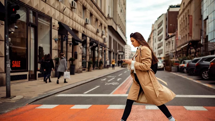 Pretty woman crossing the street