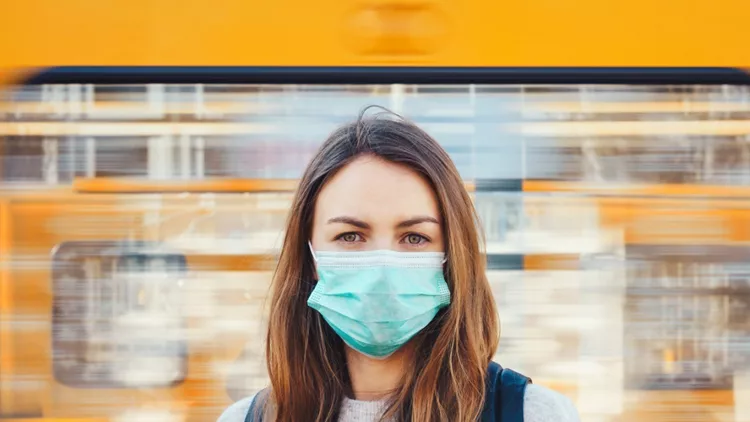 woman-wearing-a-medical-mask-in-a-subway-picture-id1216167705