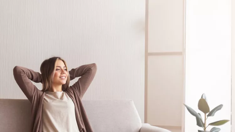millennial-girl-relaxing-at-home-on-couch-picture-id1202700827