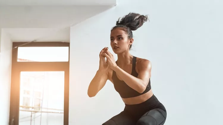 young-muscular-female-doing-jumping-squats-on-fit-box-picture-id1226866548
