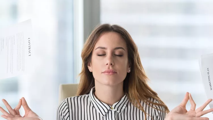 calm-female-executive-meditating-taking-break-avoiding-stressful-job-picture-id1129638579 (1)