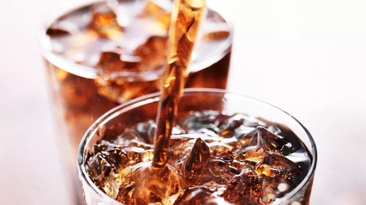soft-drink-being-poured-into-glass-picture-id533575209