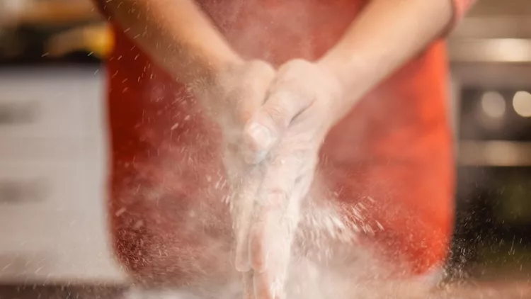 woman-preparing-dough-for-bread-picture-id1210310349