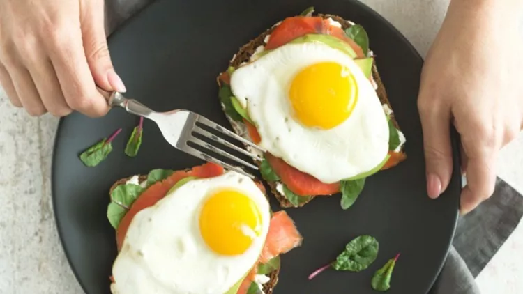 healthy-breakfast-sandwiches-woman-holding-plate-with-bread-toasts-picture-id939036178