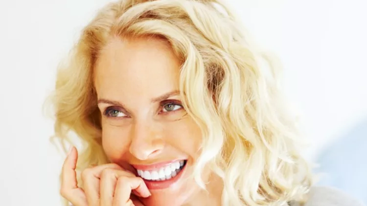 cheerful-mature-woman-with-man-in-background-picture-id182069358