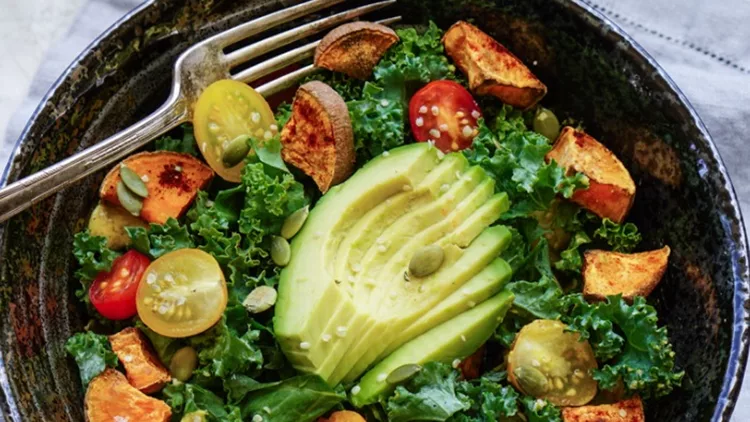 kale-roasted-yams-and-avocado-salad-picture-id514221670