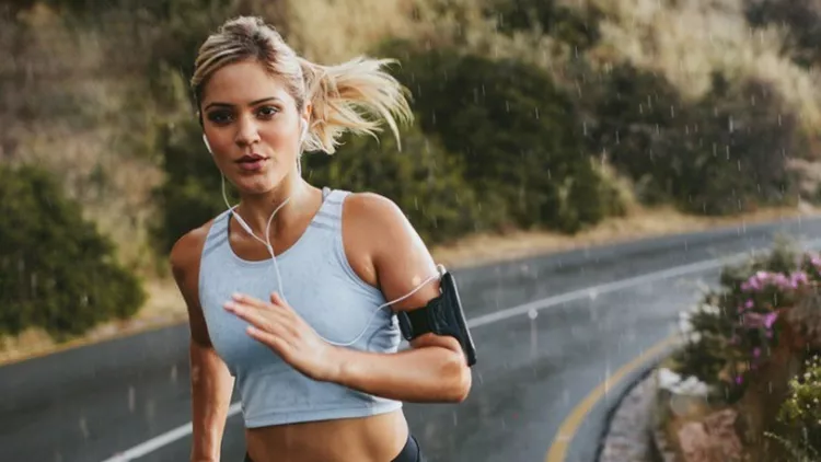 female-athlete-running-outdoors-on-highway-picture-id586069446