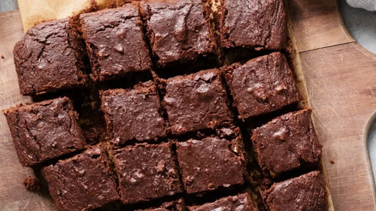 chocolate-brownie-squares-on-cutting-board-top-view-picture-id1005633958