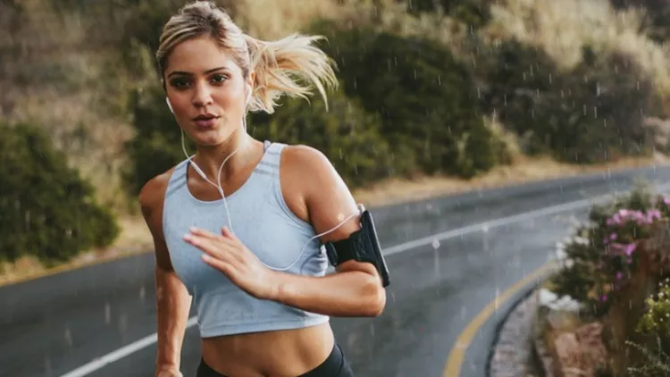female-athlete-running-outdoors-on-highway-picture-id586069446