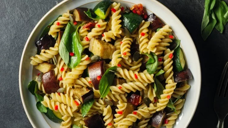healthy-vegan-pasta-bowl-with-roasted-vegetable-picture-id951153806